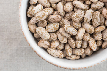 Wall Mural - Uncooked Pinto Beans in a Bowl