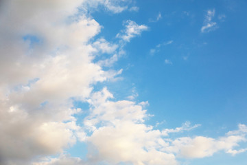 White cumulus clouds on a blue sky on a summer day. Low clouds