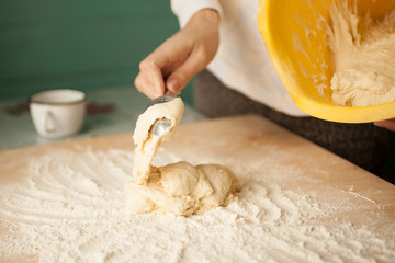 Making dough by female hands at home