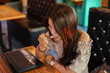 © Chittakon - Beautiful girl sitting to eat ice cream in a restaurant