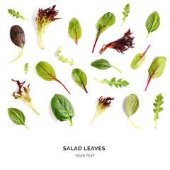 Pattern with salad leaves. Vegetable abstract background. Spinach,  lettuce, rucola on the white background.