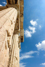 Ancient Greek Marble Columns And Blue Sky In Athenian Acropolis Greece