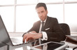 © ASDF - close up.responsible businessman sitting at the office table