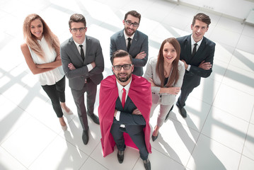 Wall Mural - top view.businessman-Superman and his business team standing together