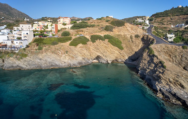 Aerial view of resort village Bali and small two cave beach. Crete, Greece