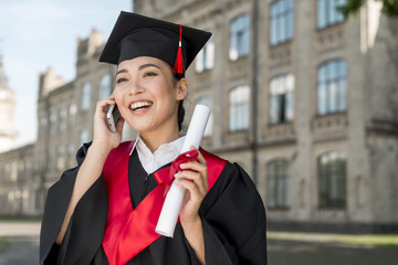 Wall Mural - Graduation concept with portrait of happy woman