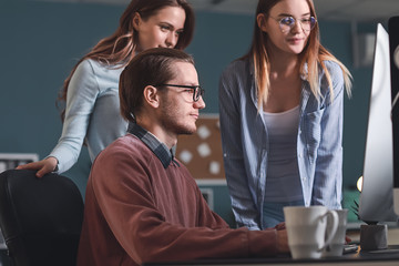 Wall Mural - Team of programmers working in office