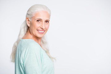 Portrait of charming person looking at camera smiling wearing turquoise jumper isolated over white background