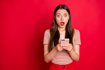 Wall Mural - photo of shocked with opened mouth big staring looking eyes teenager holding new smart telephone in 