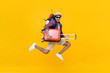 © Atstock Productions - Excited happy young Asian man tourist with luggage jumping