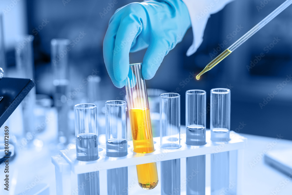 scientist with equipment and science experiments, laboratory glassware ...