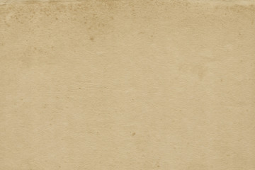 Vintage and old looking paper background. Retro cardboard texture. Grunge paper for drawing. Ancient book page.