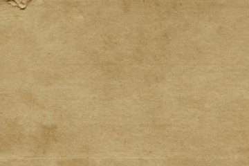 Vintage and old looking paper background. Retro cardboard texture. Grunge paper for drawing. Ancient book page.