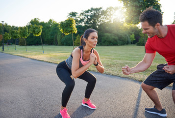 Wall Mural - Man motivates woman during hard workout