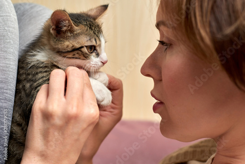 Beautiful Mature Woman Playing With A Little Cat Buy This Stock