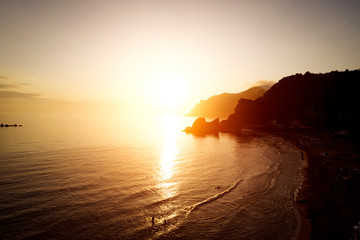 Wall Mural - Aerial view of sunset in the ocean.