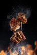 © mars58 - Fork with pieces of delicious barbecued meat on black background