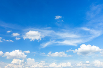 Autumn blue sky background texture with white spindrift very clouds.