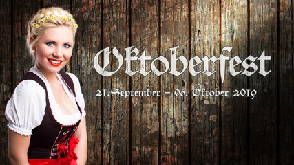 Wall Mural - Oktoberfest 2019 Banner mit junger Frau im Dirndl vor Holzhintergrund