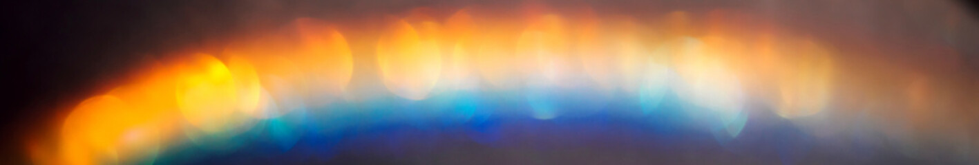 Wall Mural - iridescent holographic rainbow banner. colorful lens flare bokeh background texture