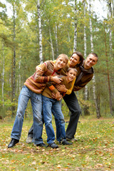 Wall Mural - Portrait of family of four in park