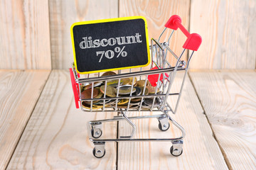 Wall Mural - Trolley and coins with sale concept