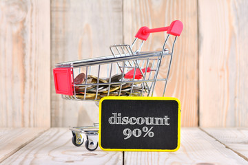 Wall Mural - Trolley and coins with sale concept