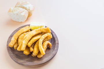 Wall Mural - Cuttlefish breaded and fried (chocos, typical tapa in spain)