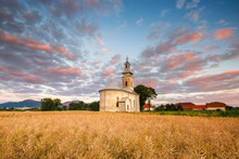 Rural Landscape With Wheat Field And A Church In Turiec, Slovakia.