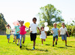 © JackF - Cheerful kids with balloons are jogging together in the park and having fun