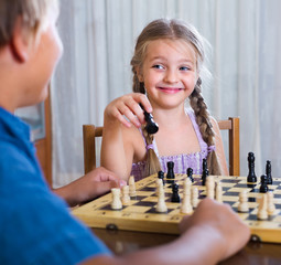 Wall Mural - children at chess board indoors