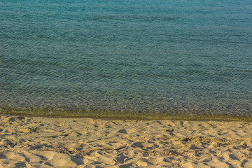 Wall Mural - simple natural background of sand beach and calm water