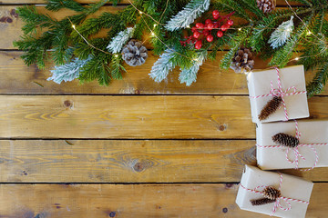 Christmas fir tree with decoration on dark wooden board