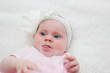 © Olga - Portrait of 4 Month Old Cute Baby Girl with Big Eyes, Infant ,lying on the white bed, New family concept, The most Beautiful Baby Princesse, Happy Baby Girl