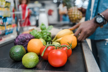 Cropped View Of African American Man Near Supermarket Counter With Fruits And Vegetables
