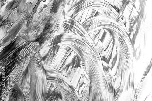 Beautiful abstract paint strokes gouache on white paper in black and white fo...
