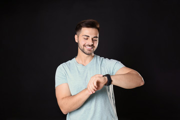 Canvas Print - Portrait of handsome man on black background