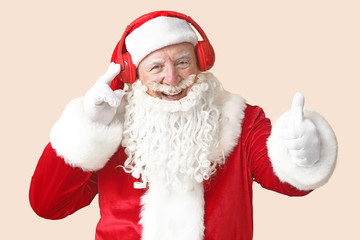 Sticker - Portrait of Santa Claus listening to music on light background