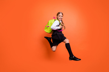 Sticker - Full length body size view of nice attractive charming cheerful cheery glad pre-teen girl nerd running fast first grade motion movement isolated on bright vivid shine orange background