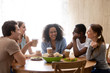 © fizkes - Happy mixed race group of best friends meeting.