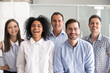 © fizkes - Laughing diverse office workers group, multiracial employees