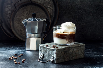 Affogato coffee with vanilla ice cream. Summer coffee drink with ice cream and espresso in the glass