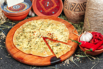  Khychyn - a flat cake made of dough sprinkled with cheese, butter and herbs according to the Georgian recipe. National cuisine