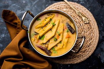 Wall Mural - Dal Dhokli, Varan Phal or Chakolya is a gujarati, Rajasthani and maharashtrian dish made using diamond shape wheat flour cakes boiled in a dal. It's an easy one pot meal. served in a bowl.