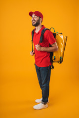 Poster - Image of smiling delivery man in red uniform carrying backpack with takeaway food