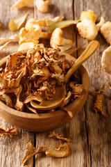 Poster - Dried fragrant chanterelle mushrooms close-up on a plate. vertical