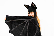 Portrait Of Girl In Bat Costume Spreading Wings