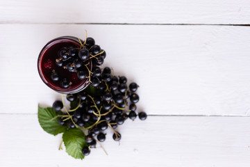 Wall Mural - source of vitamins and minerals, black currant on a jar of jam