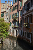 Fototapeta Uliczki - Traditional narrow canal in Venice, Italy.