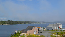 Summer In Nova Scotia: Fog Creeping Into A Cove Along Lighthouse Route Near Peggy's Cove